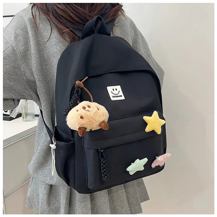 Zaino da donna in nylon di marca con ciondolo in peluche casual Borsa da viaggio per borsa da scuola a secchiello di grande capacità