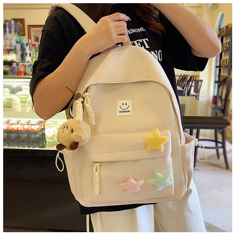 Zaino da donna in nylon di marca con ciondolo in peluche casual Borsa da viaggio per borsa da scuola a secchiello di grande capacità