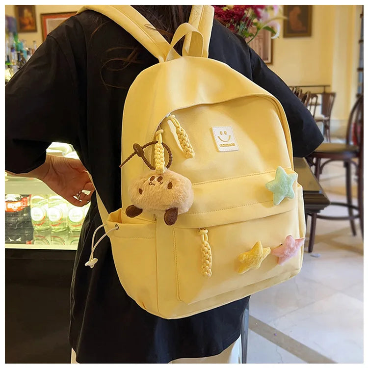 Zaino da donna in nylon di marca con ciondolo in peluche casual Borsa da viaggio per borsa da scuola a secchiello di grande capacità