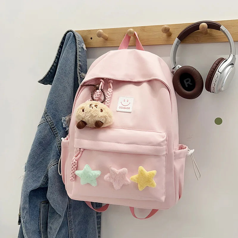 Zaino da donna in nylon di marca con ciondolo in peluche casual Borsa da viaggio per borsa da scuola a secchiello di grande capacità